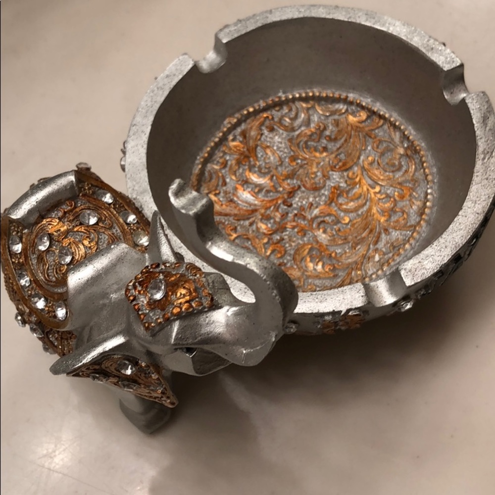 Elephant figurine ashtray.